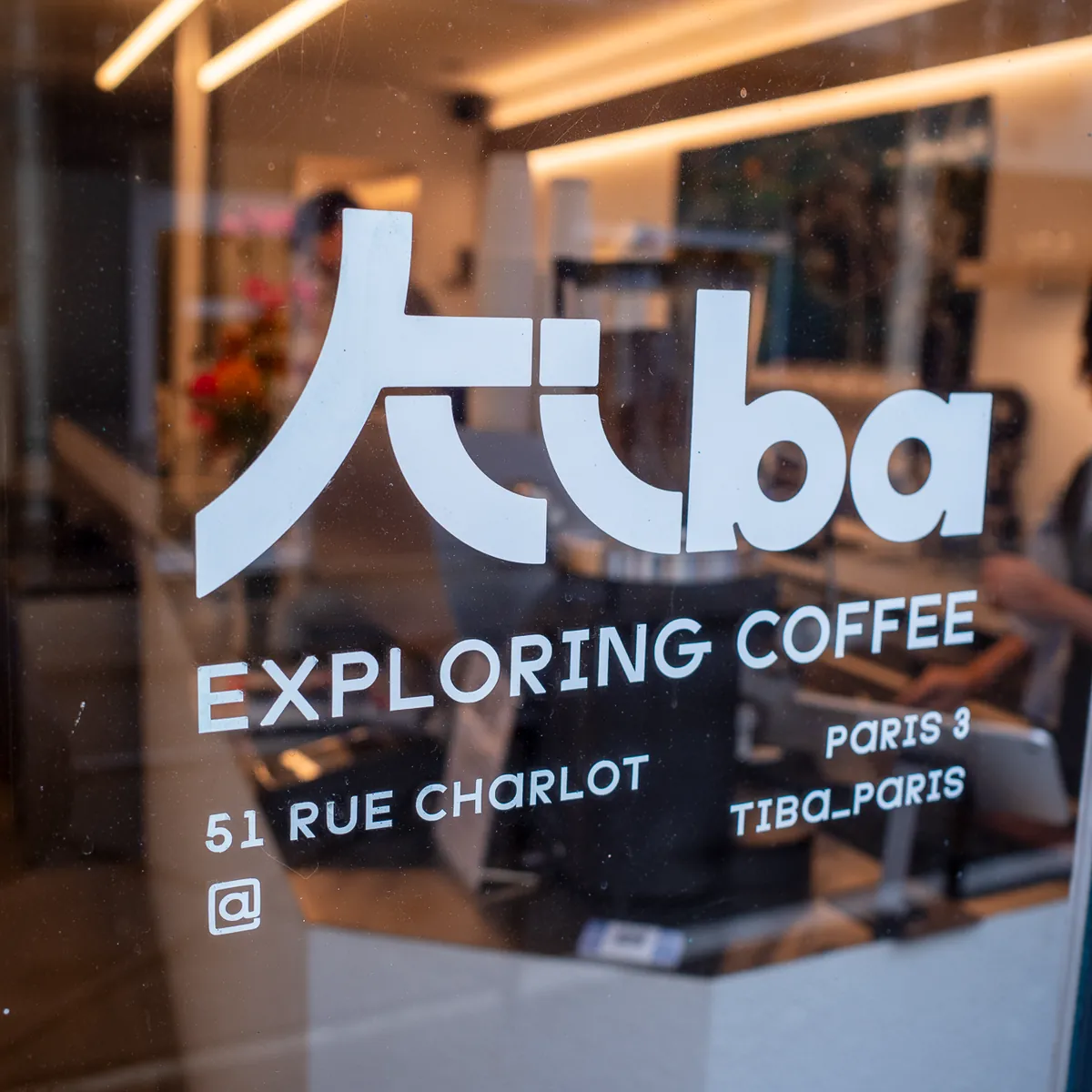 The Tiba coffee sign on a window in Rue Charlot.